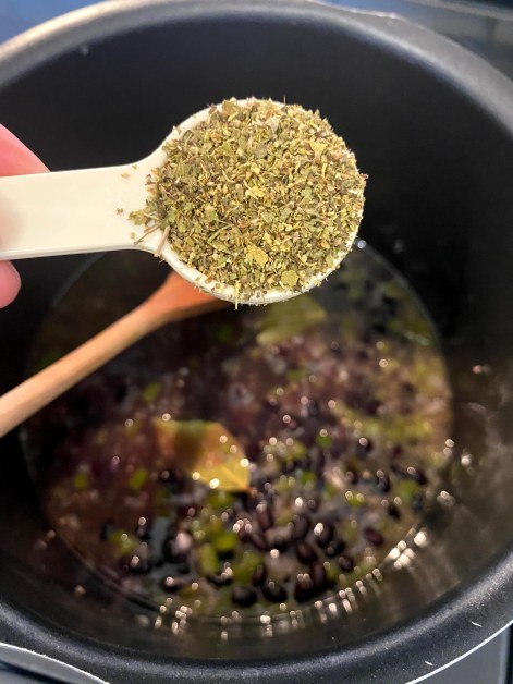 Adding oregano to black beans